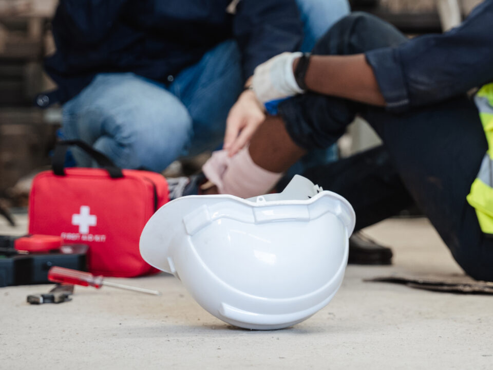 Injured construction worker with hardhat